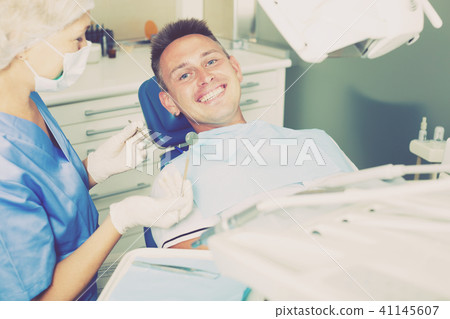 Young man on dental checkup Young man on dental checkup 41145607