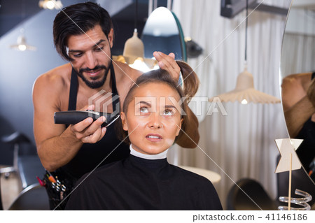 hairdresser working with hair clipper hairdresser working with hair clipper 41146186