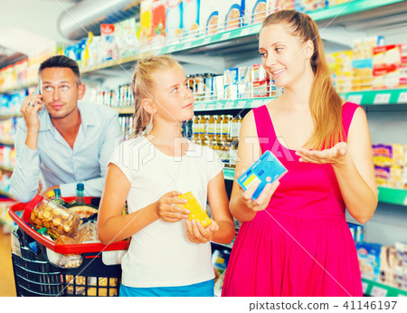 frustration man with family in supermarket frustration man with family in supermarket 41146197