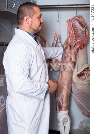 staff selling halal meat staff selling halal meat 41147322