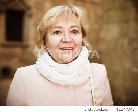 Female in the city in scarf and coat Female in the city in scarf and coat 41147348