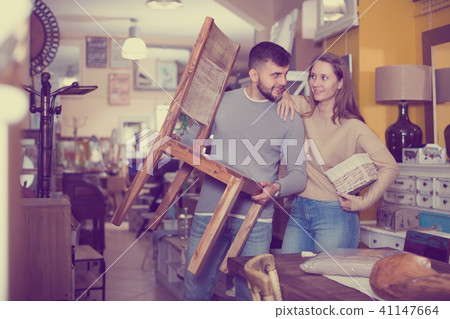 Couple arranging furniture in apartment Couple arranging furniture in apartment 41147664