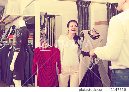 Ordinary couple purchasing dress and blouse 41147836