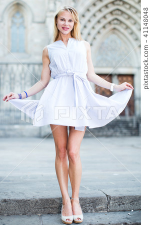 Positive female walking at the street 41148048
