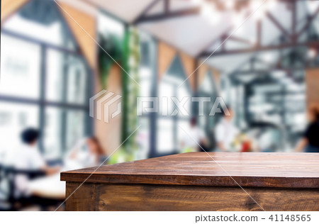 Selected focus empty brown wooden table and Coffee shop blur bac 41148565