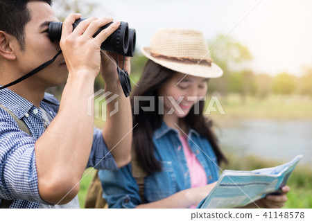 Outdoor shot of happy young loving couple hikers at valley of th 41148578