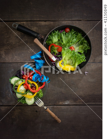 Fresh vegetables salad on the pan and bowl with  41150849