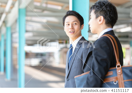Businessman talking on the platform of the station Mid-level employee business image 41151117
