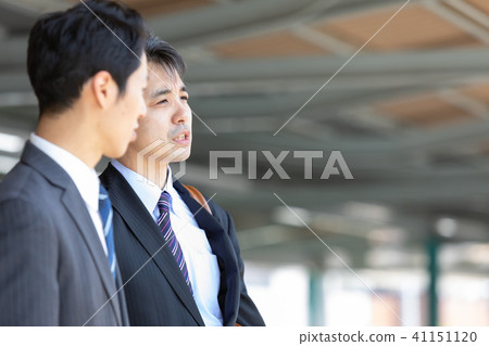 Businessman talking on the platform of the station Mid-level employee business image 41151120