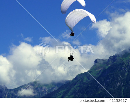 paragliding, parachute mountain in Switzerland 41152617