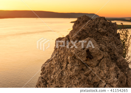 Beautiful sunset in rocky stone beach. Seascape Beautiful sunset in rocky stone beach. Seascape 41154265
