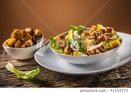Delicious salad caesar with grilled chicken breast 41154373