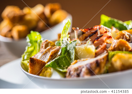 Delicious salad caesar with grilled chicken breast Delicious salad caesar with grilled chicken breast 41154385