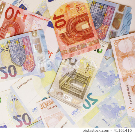 Cash on table isolated: dollars, euro, rubl broken money. All in mess, global crisis concept Cash on table isolated: dollars, euro, rubl broken money. All in mess, global crisis concept 41161410