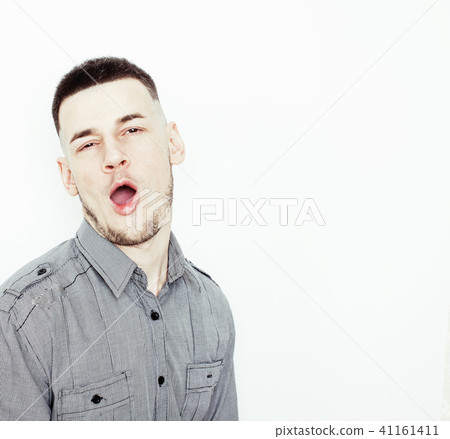 young handsome teenage hipster guy posing emotional, happy smiling against white background isolated 41161411
