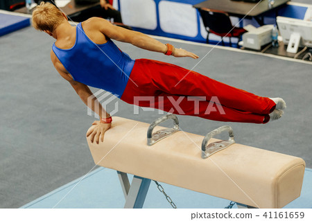gymnast exercises on pomme horse gymnast exercises on pomme horse 41161659