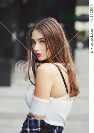 beautiful brunette girl on the street 41162069