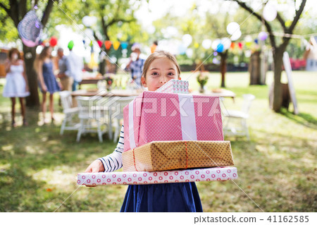Family celebration or a garden party outside in the backyard. 41162585