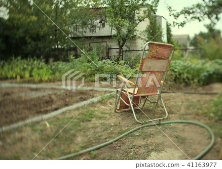 clamshell chair in the garden 41163977