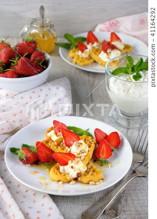 Belgian waffles with whipped cream   strawberries 41164292