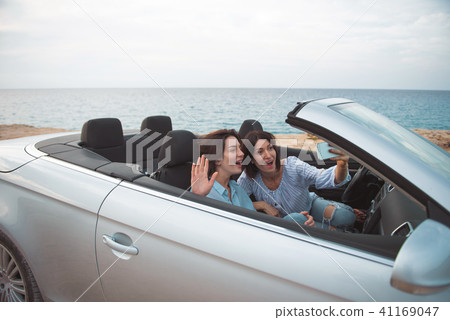 Joyful girls making photo in car 41169047