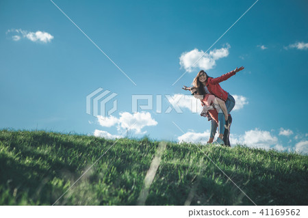 Happy loving couple having fun on hill 41169562