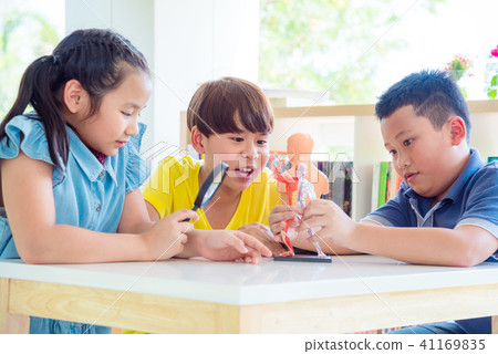 student learning about human anatomy from model  41169835