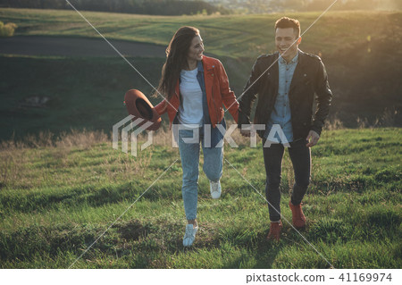 Joyful girl looking at smiling boyfriend in nature Joyful girl looking at smiling boyfriend in nature 41169974