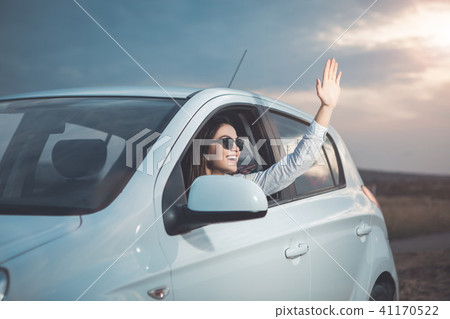 Happy young woman having fun during journey by personal transport Happy young woman having fun during journey by personal transport 41170522