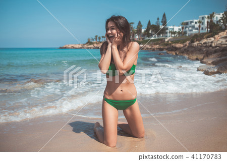 Joyful girl enjoying sea view  41170783