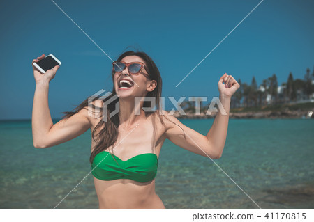 Glad girl enjoying summer resort at the sea Glad girl enjoying summer resort at the sea 41170815
