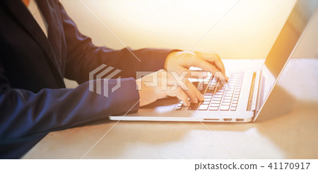 business woman working on notebook business woman working on notebook 41170917