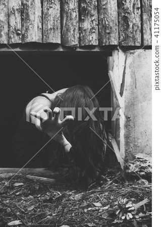 girl on the ground with hair on her face with h 41175054