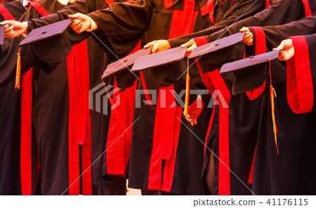 Graduate Student hold hat in graduation ceremony 41176115
