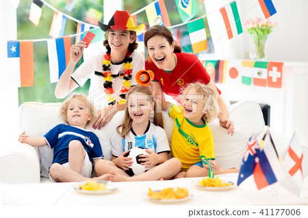 Fans watch football game. Family watching soccer. 41177006