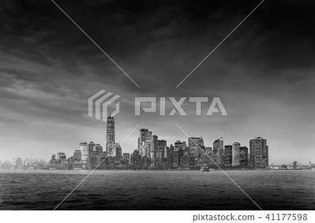 Panoramic view of storm over Lower Manhattan from Ellis Island at dusk, New York City. 41177598