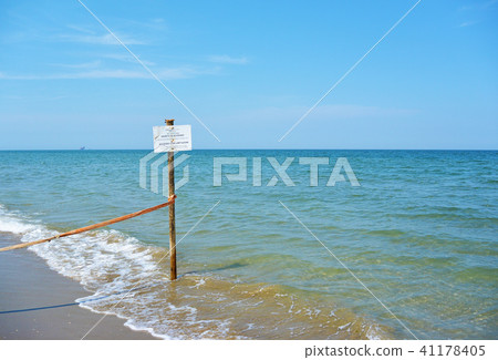 Warning Sign on the beach of the nature reserve at the mouth of the river Bevano Warning Sign on the beach of the nature reserve at the mouth of the river Bevano 41178405