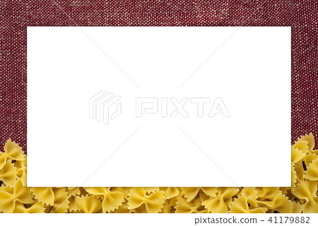 farfalle macaroni Beautiful decomposed pasta from the bottom on a rustic red-brown textured 41179882