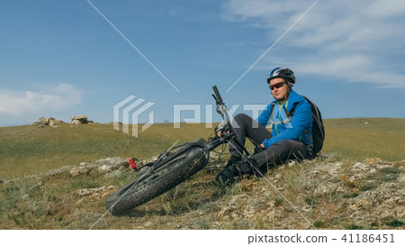 Fat bike also called fatbike or fat-tire bike in summer driving the hills. Fat bike also called fatbike or fat-tire bike in summer driving the hills. 41186451