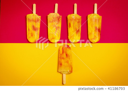 isolated yellow-red ice cream on a colorful background 41186703