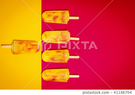isolated yellow-red ice cream on a colorful background 41186704