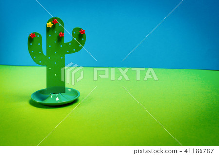 holiday background with a small toy cactus holiday background with a small toy cactus 41186787