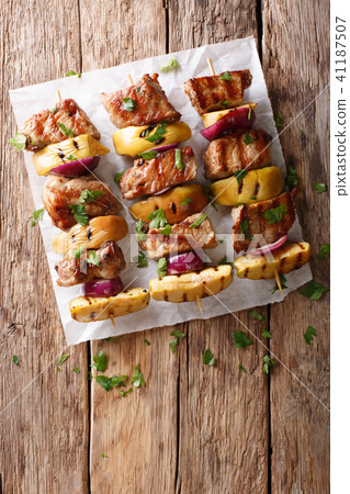 Rustic juicy kebabs of pork with apples Rustic juicy kebabs of pork with apples 41187507