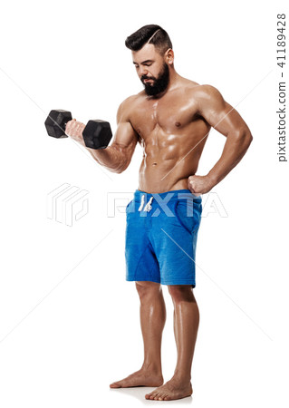 muscular man doing exercises with dumbbells. 41189428