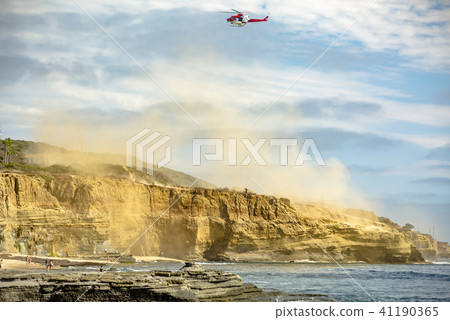 US coastguard helicopter in flight with clouds US coastguard helicopter in flight with clouds 41190365