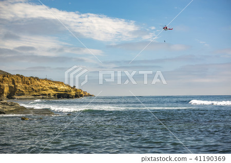 US coastguard helicopter in flight, off the coast 41190369