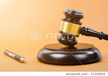 Wooden judge gavel with pen. Wooden judge gavel with pen. 41199995