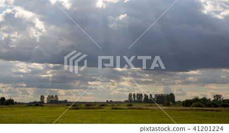 Cloudy sky and sun behind Cloudy sky and sun behind 41201224