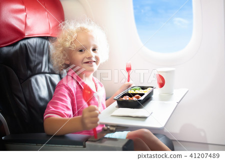 Child in airplane. Kids fly. Children flight meal 41207489