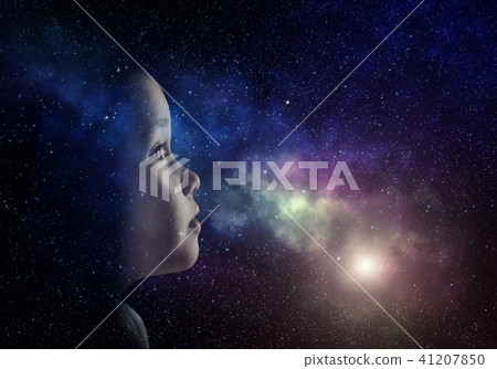 A little girl is looking at the sky 41207850